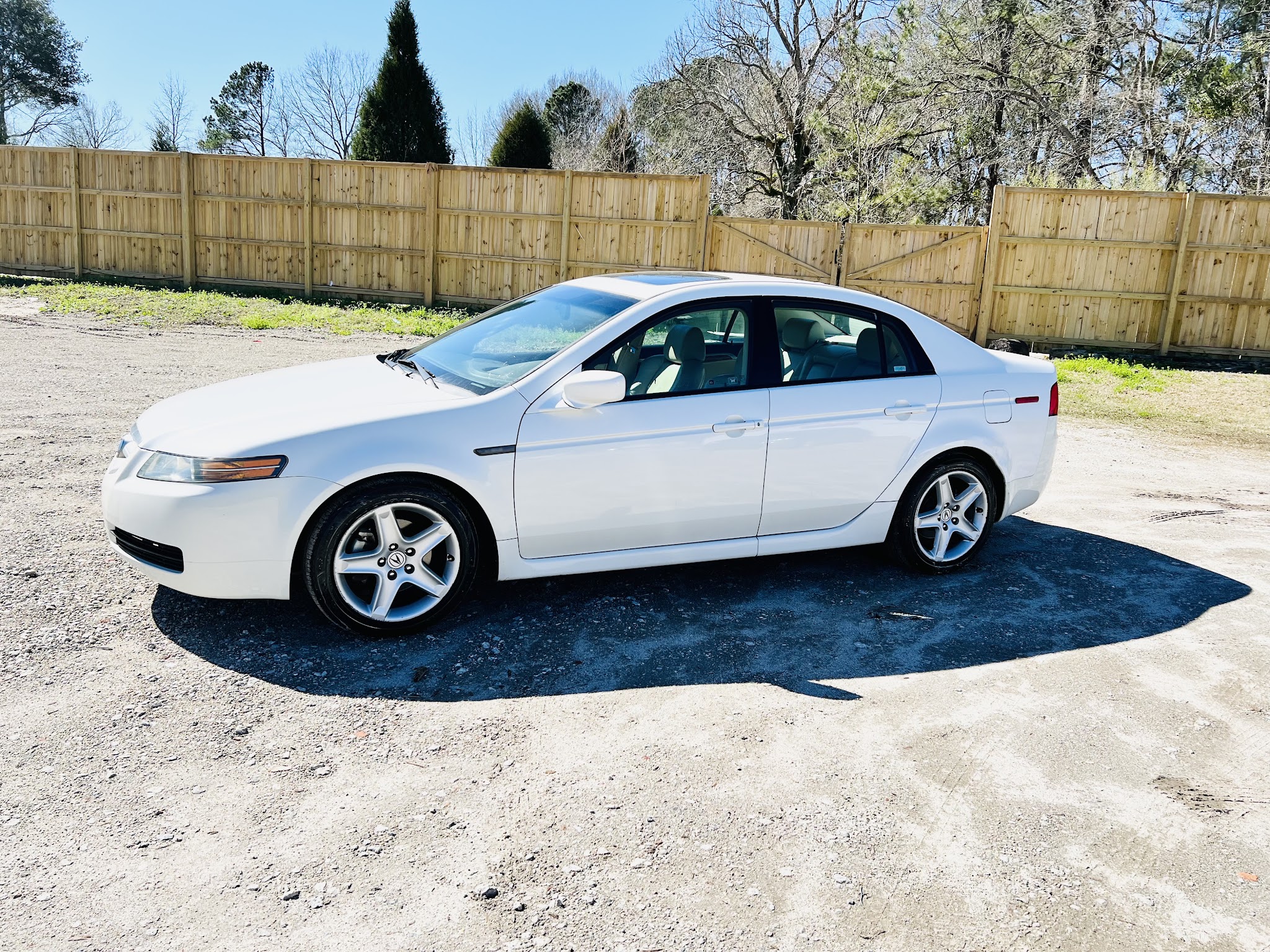 White sedan with alloy wheels on our lot