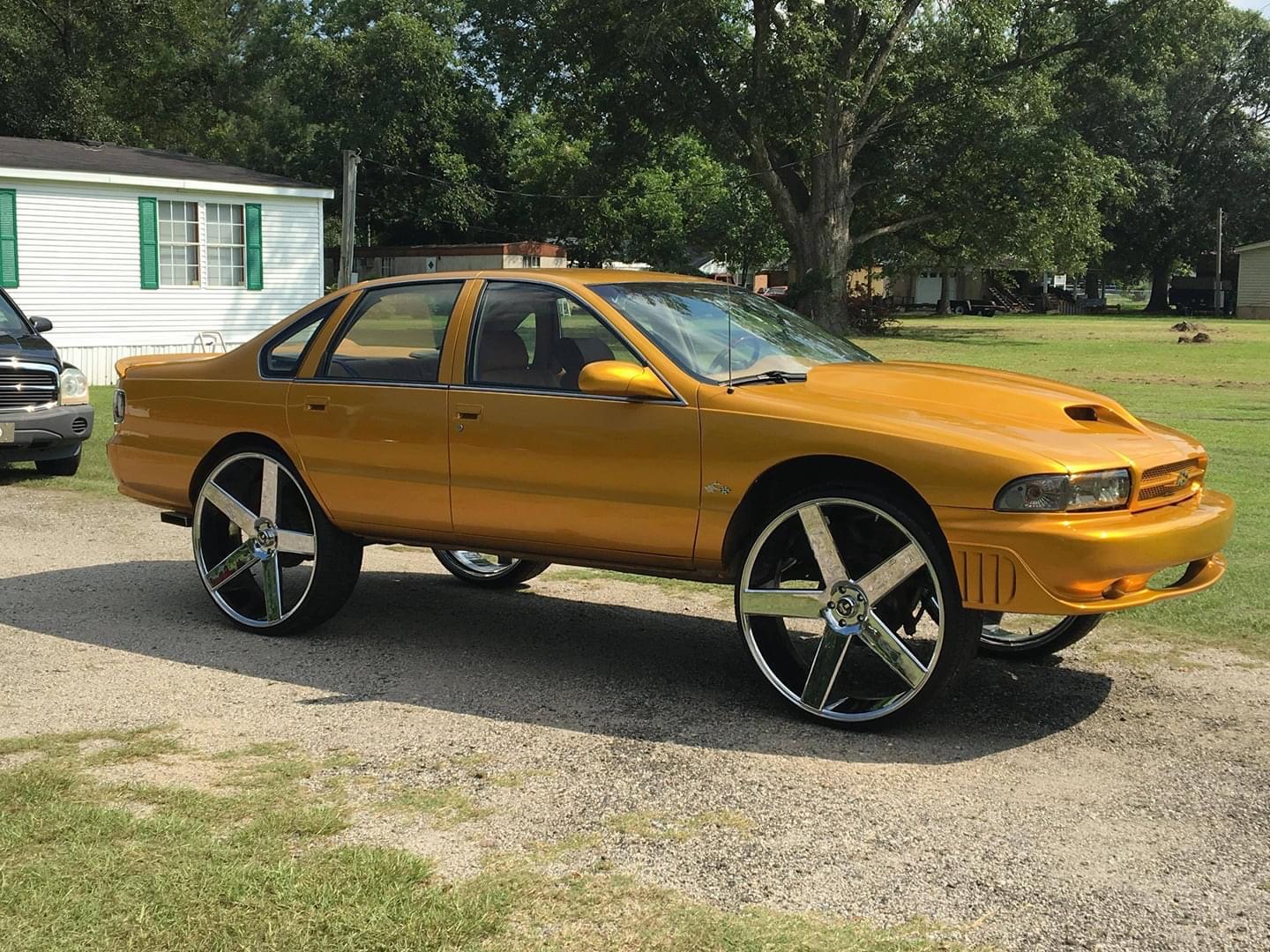 Gold sedan on chrome wheels